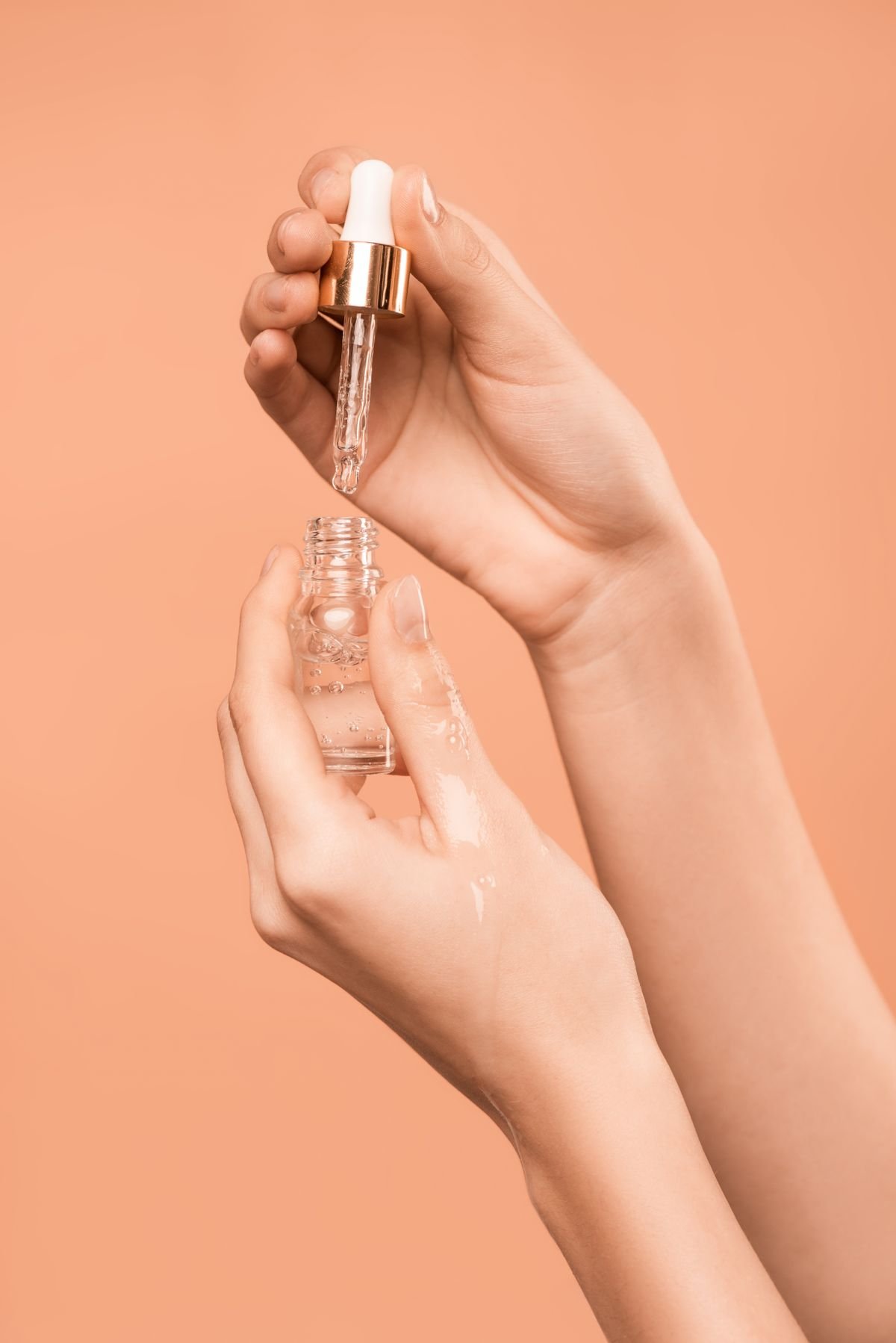 Close-up of a skincare serum dropper bottle showing how product consistency and labelling reveal ingredient quality