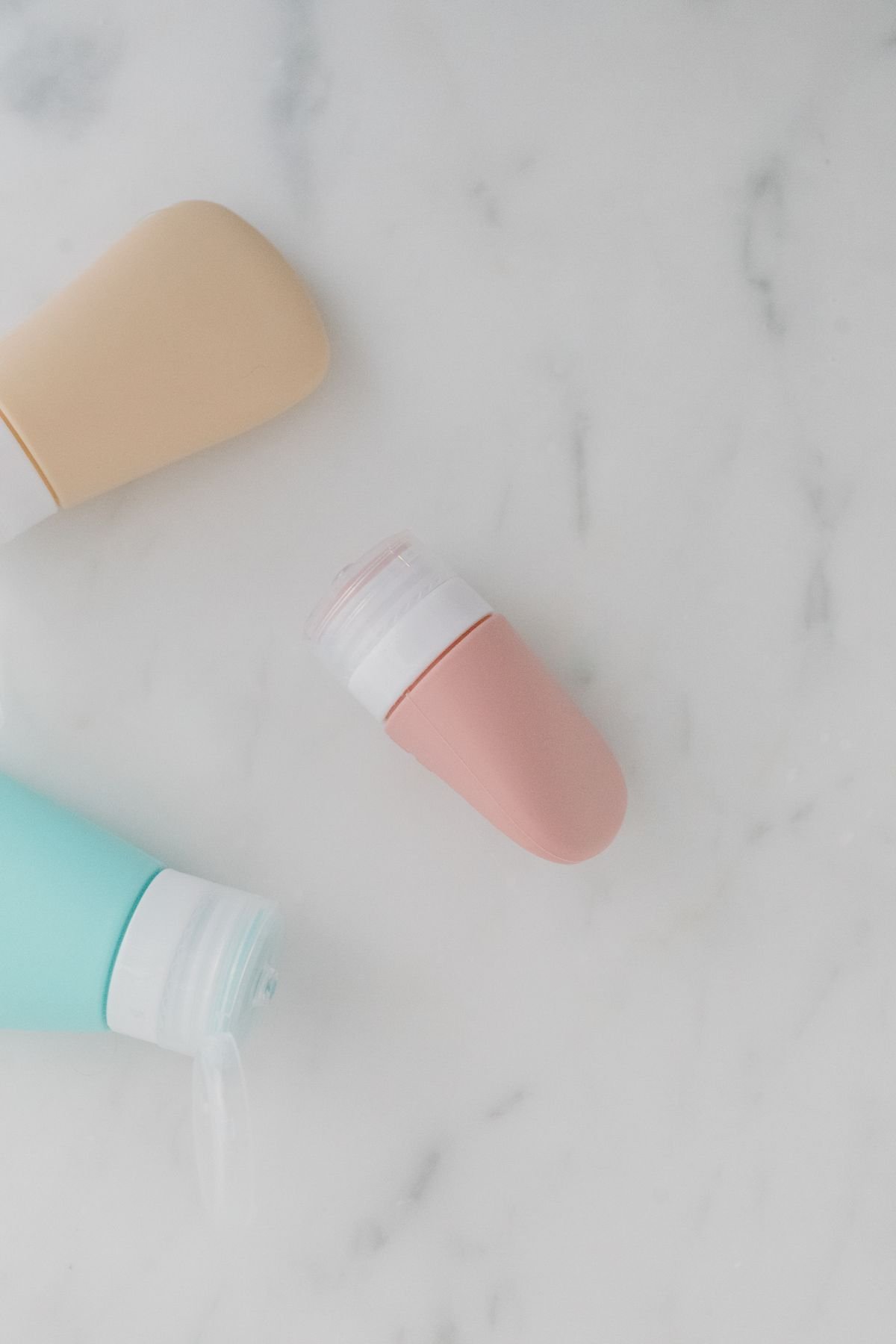 Skincare bottles arranged in a minimalist flatlay