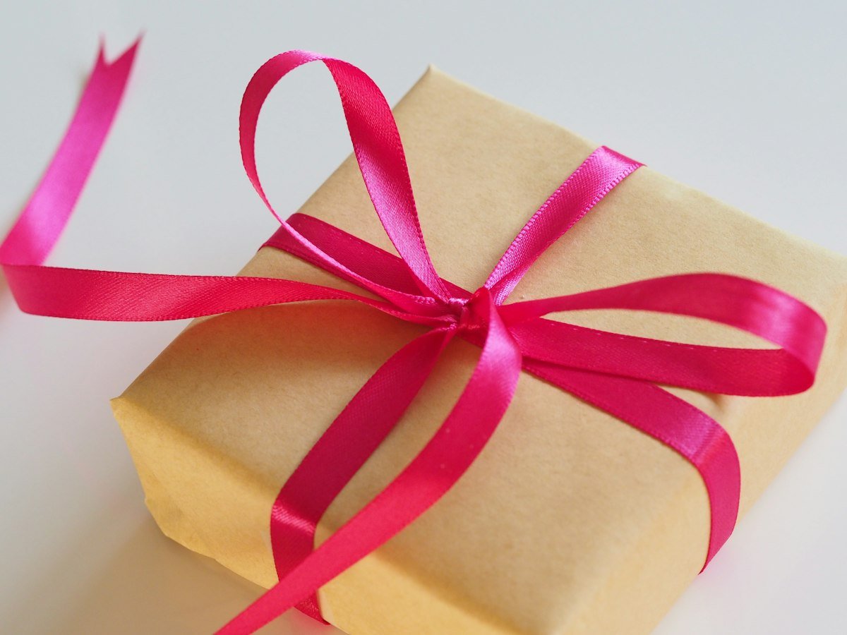 A neatly wrapped gift with ribbon ready for giving