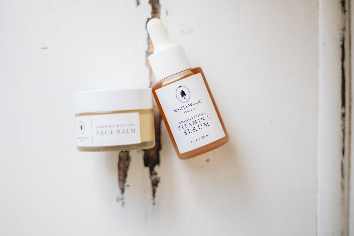 Minimalist Korean skincare product flat lay with natural elements on a neutral background